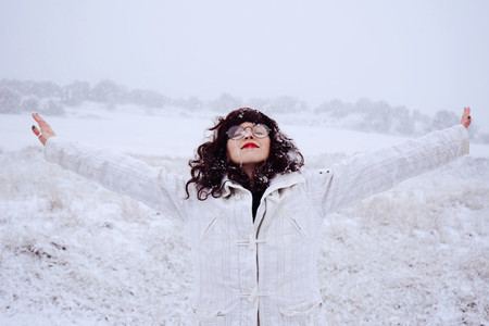 Young woman enjoying a snowy day