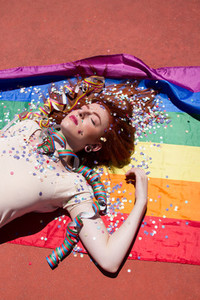 Young woman and rainbow flag