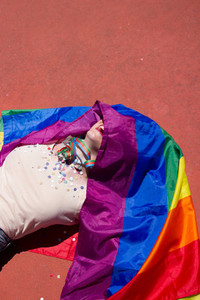 Young woman and rainbow flag
