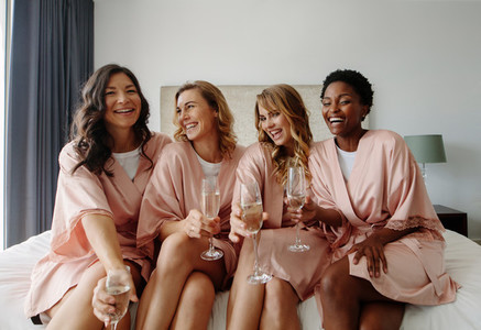 Bride and bridesmaids celebrating hen party