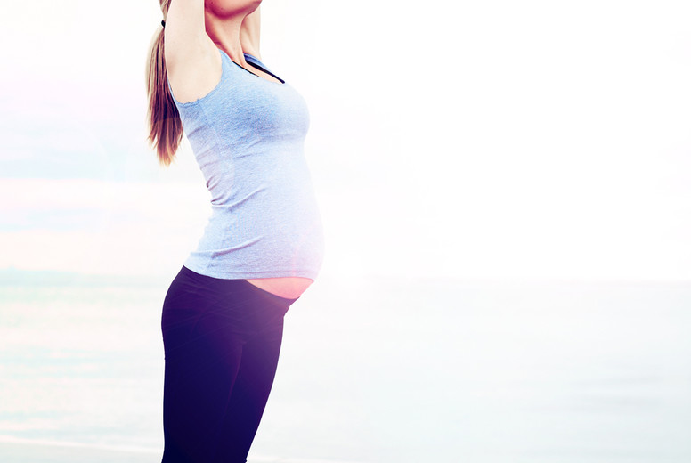 Pregnant woman doing aerobics exercises