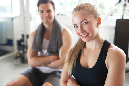 Portrait of Confident Woman and Man in Gym