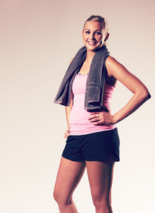 Woman posing with hand on hip wearing workout clothes