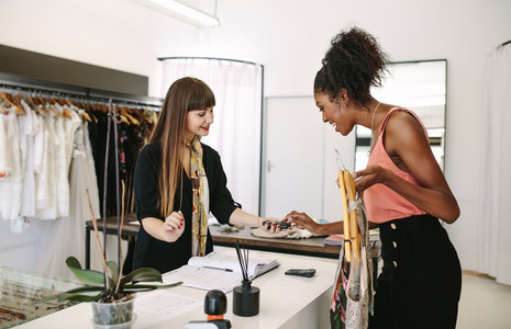 Woman entrepreneur making sale in her fashion studio
