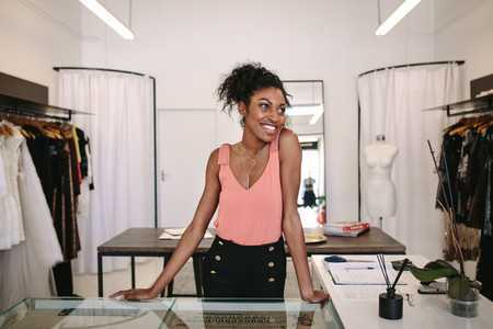 Woman entrepreneur at work in her fashion boutique