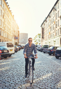 Man riding his bike through the city