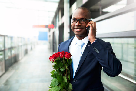 African American holding a bouquet of roses