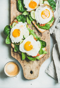 Healthy breakfast sandwiches and cup of coffee on board