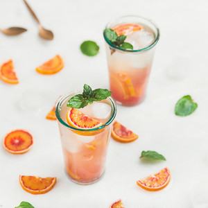 Blood orange fresh lemonade with ice and mint  square crop