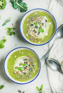 Spring broccoli cream soup with fresh mint and coconut cream