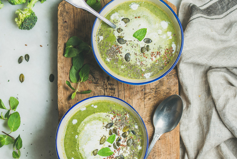 Spring vegetarian broccoli cream soup with mint and coconut cream