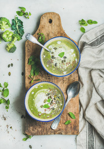 Spring vegetarian broccoli cream soup with mint and coconut cream