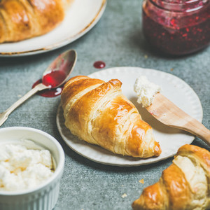 Croissants with raspberry jam ricotta cheese and milk square crop