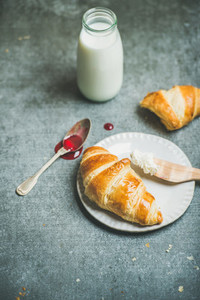 Croissants with raspberry jam ricotta cheese and milk copy space
