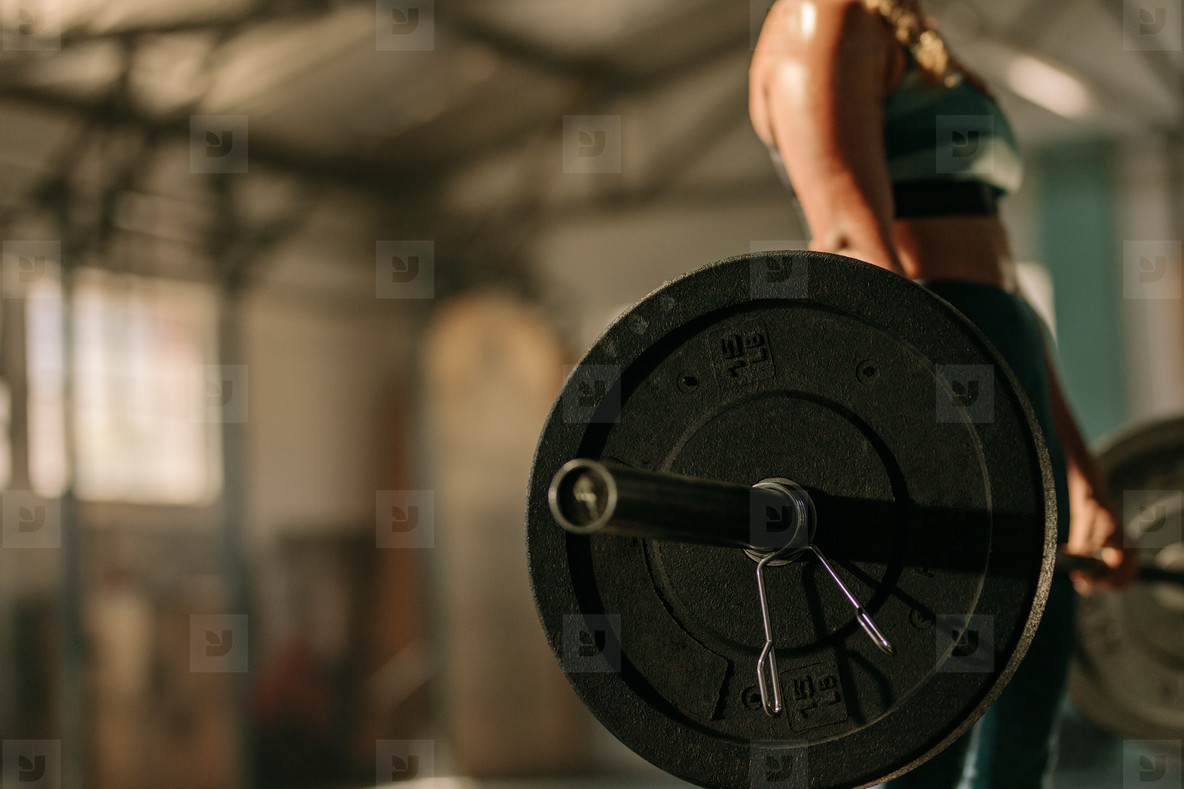 Heavy weights exercises performed by female athlete