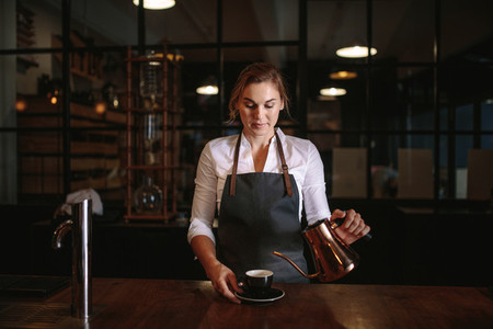 Female barista preparing coffee