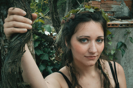face of forest elf with plants in her hair natural make up