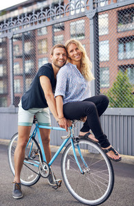 Loving couple riding bikes
