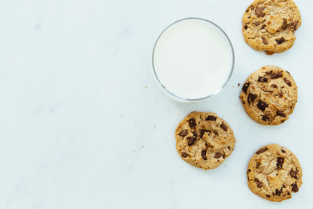 Milk and cookies on white background with copy space