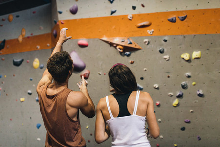 Man and woman at an indoor rock climbing gym