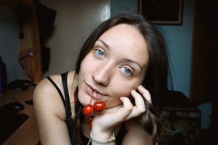 blue eyed girl with cherries
