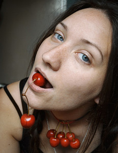 blue eyed girl with cherries