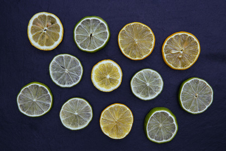 Lemon lime slices food on dark background