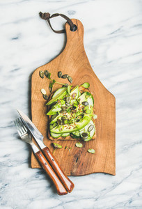Healthy green veggie sandwich with avocado  cucumber  seeds  sporouts