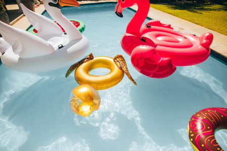 Colorful inflatable toys floating in a pool