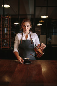 Female barista preparing coffee