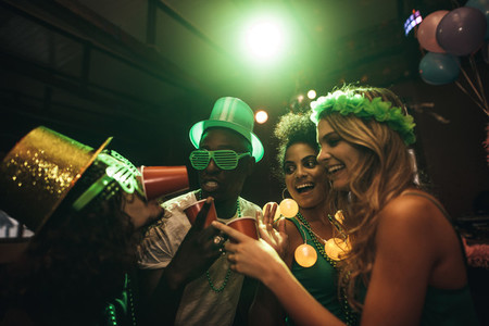 Friends celebrating St Patricks Day in nightclub