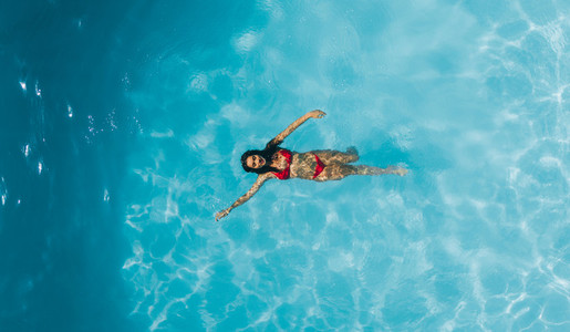 Woman enjoying swimming in a pool