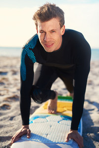 Surfer demonstrating a surfing pose on his board