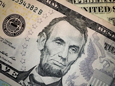 Abraham Abe Lincoln face portrait on 5 dollar bill macro  United