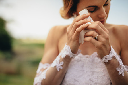 Emotional bride weeps tears of happiness