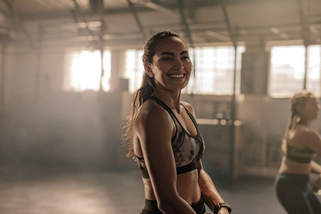 Smiling young women in gym