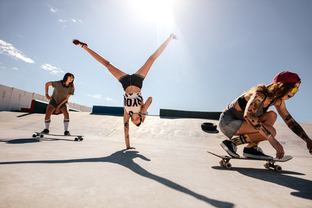 Female skaters enjoying at skate park
