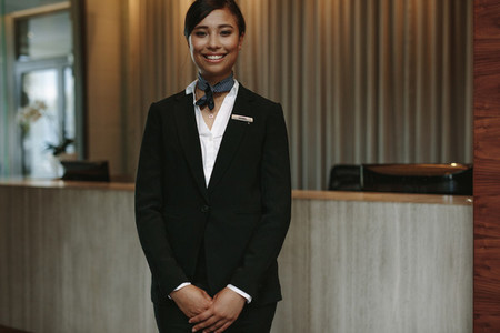 Female concierge ready to welcome guest