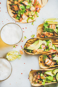 Healthy corn tortillas with chicken vegetables beer on grey background