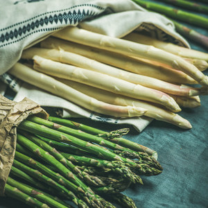 Fresh green and white asparagus in towel  square crop