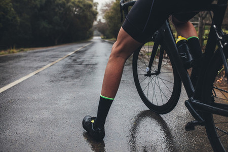 Cyclist training on wet road