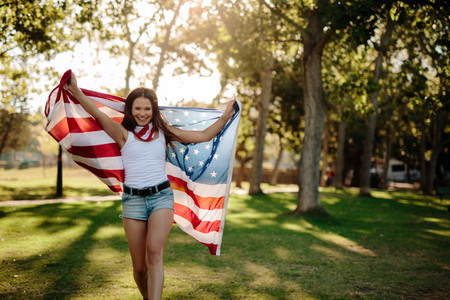 Girl waving American flag