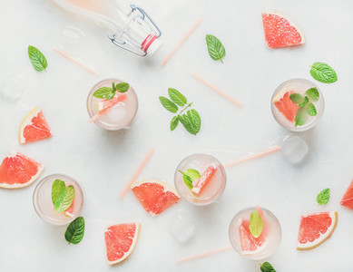 Flat lay of cold refreshing summer alcohol cocktail with fresh grapefruit