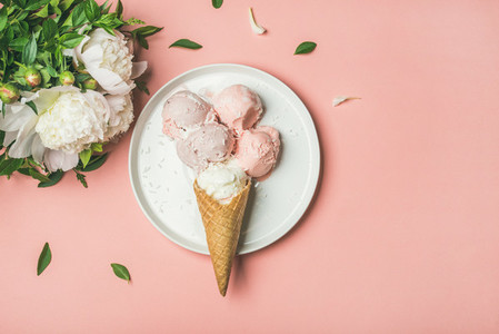 Strawberry and coconut ice cream cones white peonies copy space