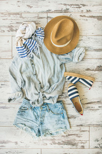 Summer outfit flatlay  parquet background  top view