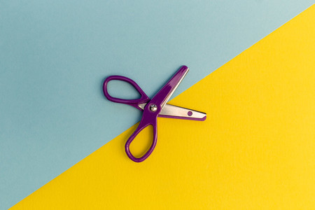 Scissors cutting line stationery concept