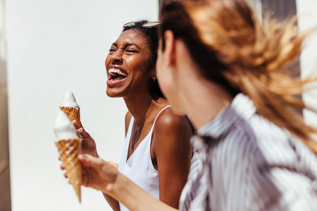 Friends enjoying ice creams on a sunny day