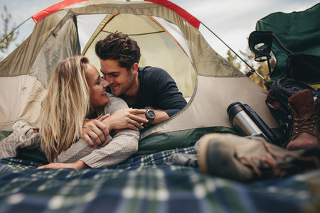 Romantic couple camping in nature
