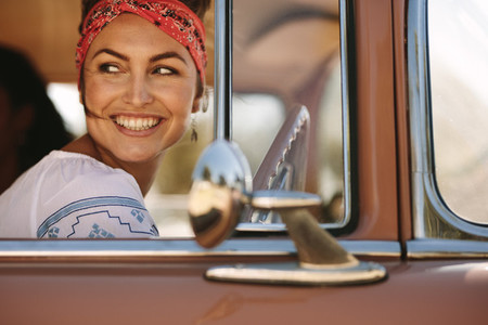 Woman looking outside while driving