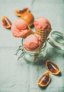 Refreshing summer blood orange ice cream and fruits copy space